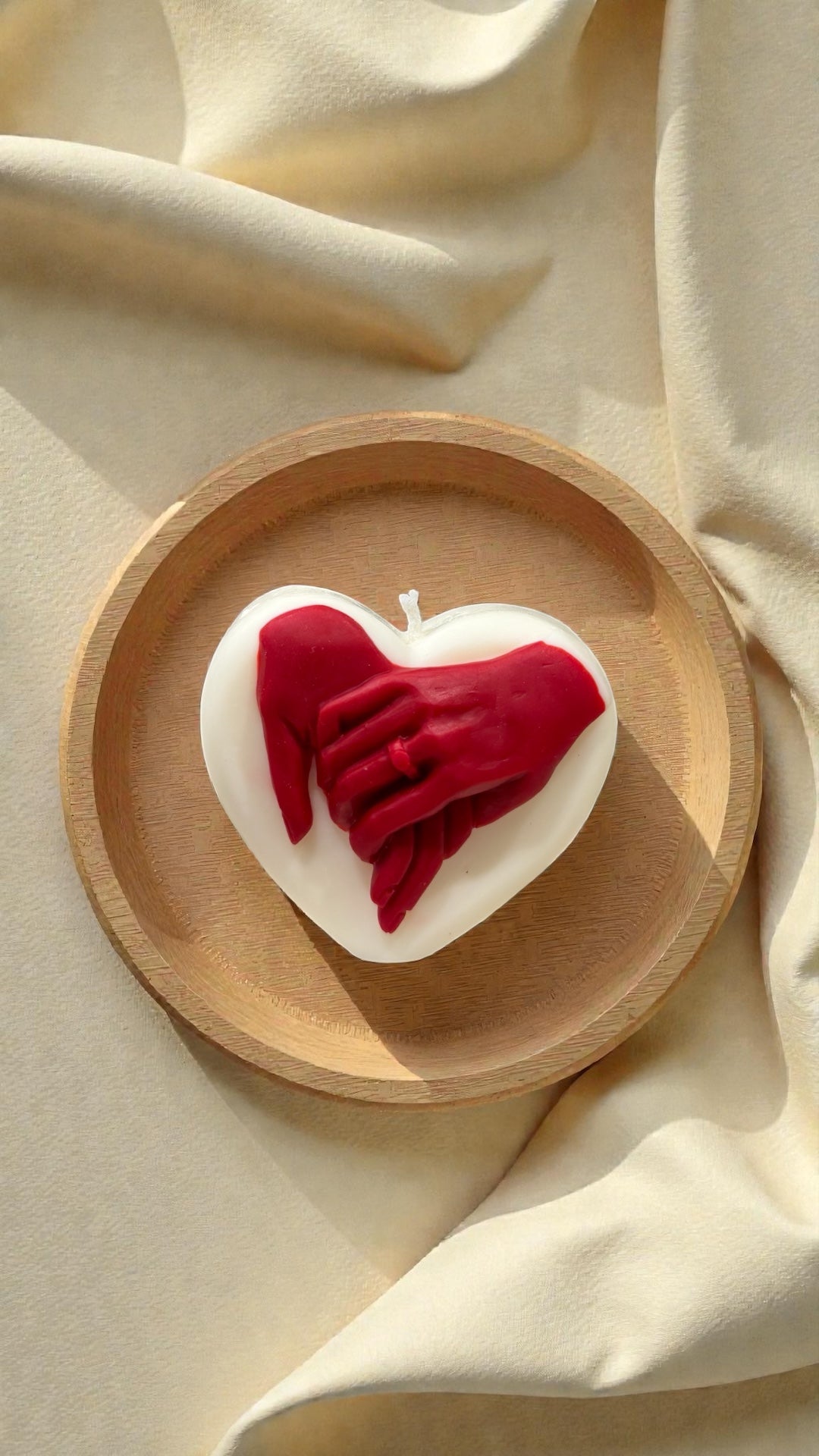 Two hands one heart candle