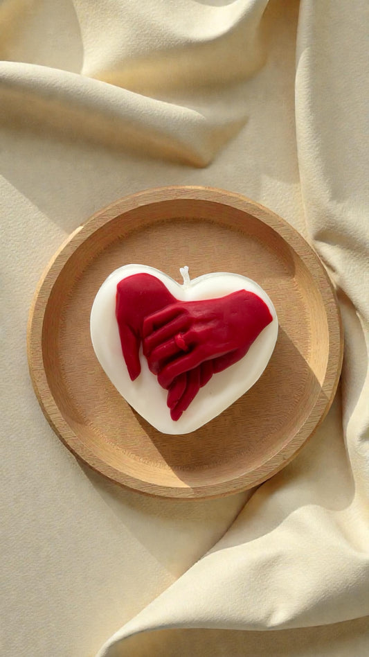 Two hands one heart candle